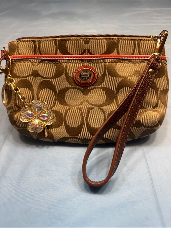 Coach Handbags - Coach Tan Signature Wristlet with Brown Trim and Coral Accent and key charm